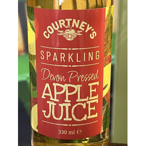 Close up of the red label on a 330ml bottle of Courtney's sparkling apple juice