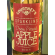 Close up of the red label on a 330ml bottle of Courtney's sparkling apple juice